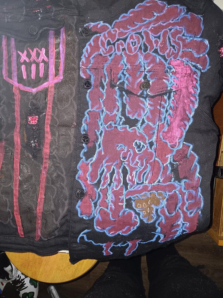 A front and back of a jean jacket I made for myself for my charity organization Papa Greyhand CROWS